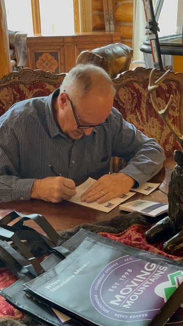 Father writing a note to leave with a Heaven booklet